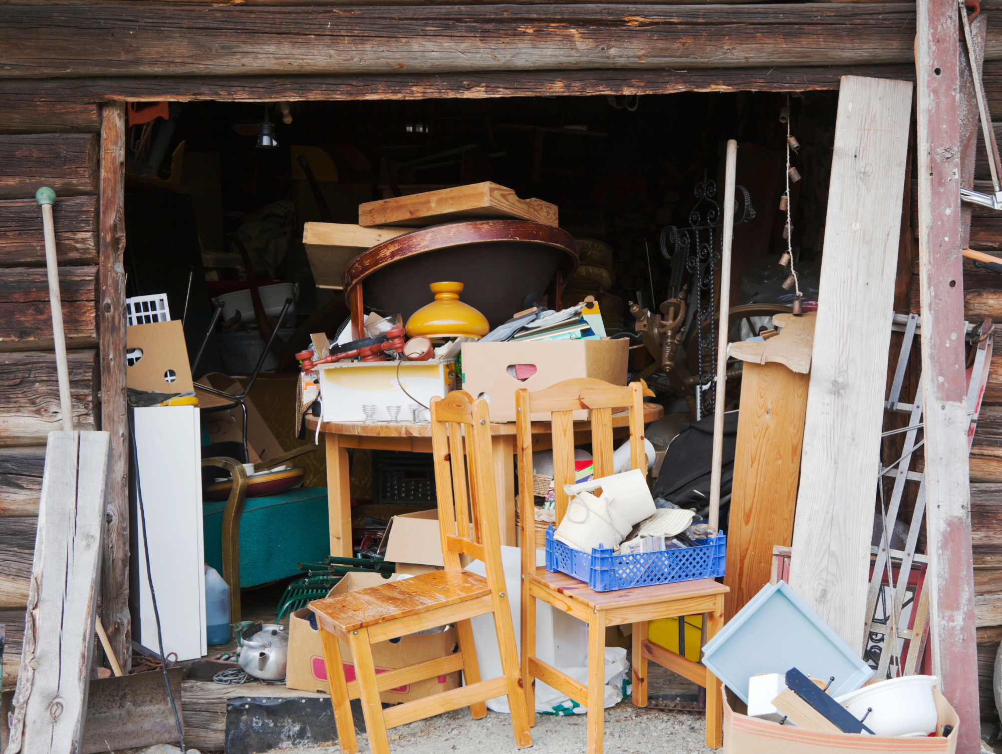 Image of a deceased estate rubbish removal service in Brisbane. Image shows old furniture and household junk